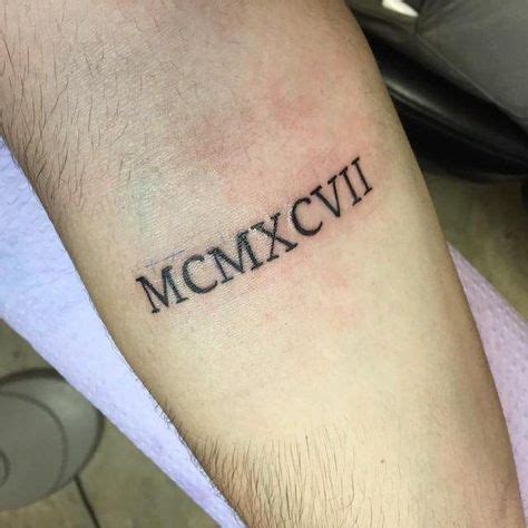 XCVII: Timeless Tribute with 1997 in Roman Numerals Tattoo